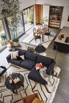 an aerial view of a living room and dining area