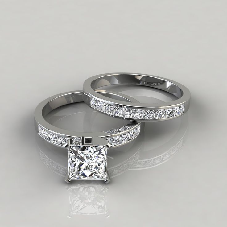 two white gold wedding rings with princess cut diamonds