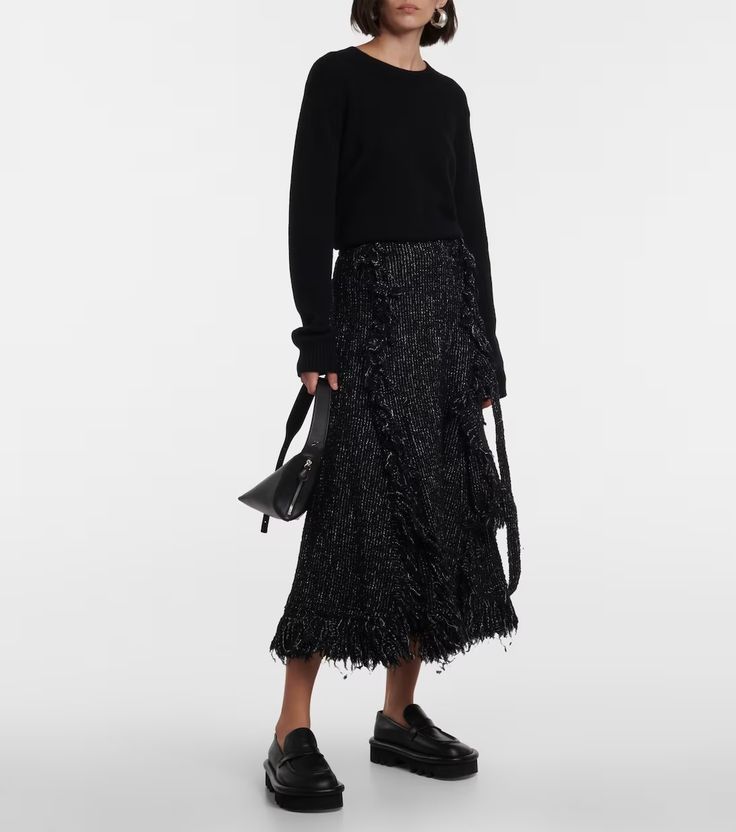 Fringed flared tweed midi skirt in black - Sacai | Mytheresa Chic Wool Midi Skirt, Spring Wool Midi Skirt, Chic Wool Flared Skirt, Chic Wool Mini Skirt, Chic Wool Skirt For Winter, Chic Winter Wool Skirt, Chic Flowy Wool Skirt, Spring Chic Wool Skirt, Wool Long Skirt For Spring