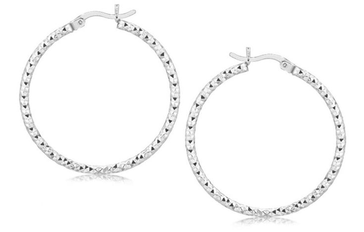 Weave inspired faceted motifs showcase the loveliness of these medium sized thin sterling silver hoop earrings. Finished with rhodium plating, these come with snap locks. Earring Information Metal:           925     Sterling Silver Approximate Weight:   3 gram(s) Backing:  Snap Lock Diameter:  30.00 mm Width:          2.00 mm Rhodium Polish:   Yes Snap Lock, Sterling Silver Hoop Earrings, Sterling Silver Hoops, Jewelry Earrings Hoops, Silver Hoops, Silver Hoop Earrings, Rhodium Plated, Medium Size, Halloween Shopping