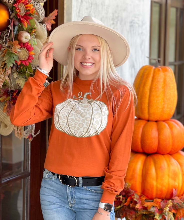 There is so much to love about the fall, this Leopard Pumpkin Shirt is just one of them! This beautiful light leopard pumpkin design is available on your choice of shirt color and style. Choose from short sleeve, long sleeve, or sweatshirt to meet your needs. This pumpkin shirt is perfect for layering under a cardigan or pairing with leggings! This festive pumpkin tee shirt is perfect for dressing up or down depending on the festivities! 
Born To Be Sassy offers a wide selection of fall clo Fall Long Sleeve Relaxed Fit T-shirt, White Tops For Fall, Relaxed Fit T-shirt For Fall, Trendy Brown T-shirt For Fall, Orange Crew Neck Top For Fall, Orange Long Sleeve T-shirt For Fall, Orange Relaxed Fit Tops For Fall, Trendy Orange Fall Tops, Orange Cotton Top For Fall