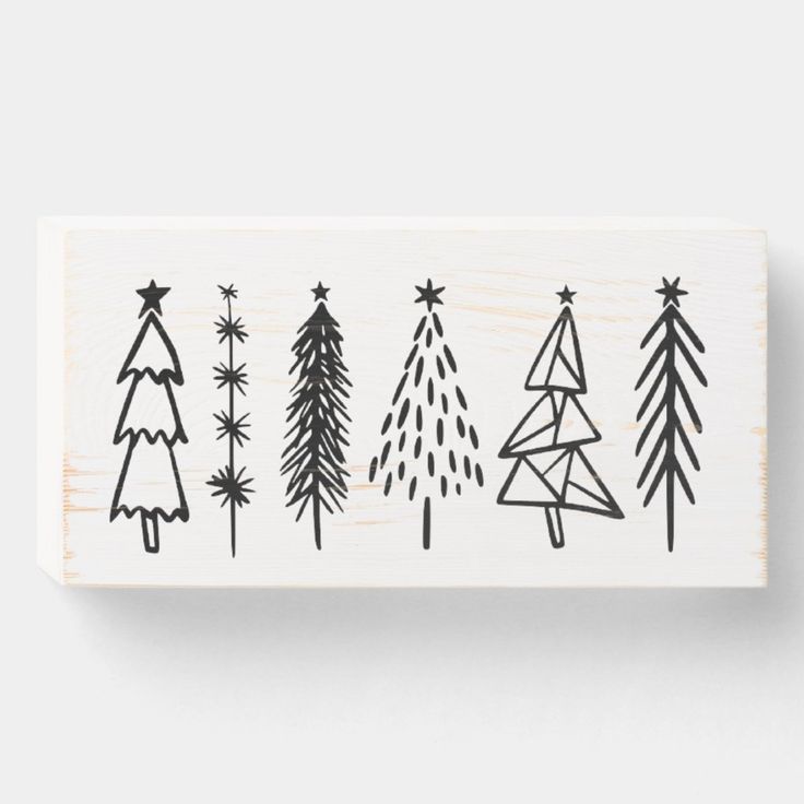 a rubber stamp with christmas trees on it