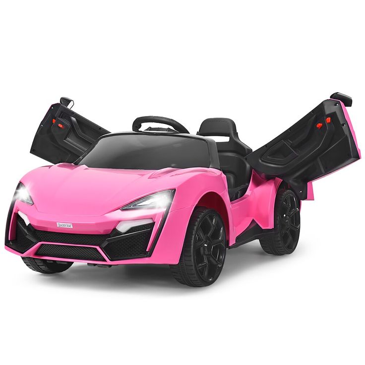 a pink toy car with its doors open and seats folded down on the front wheel