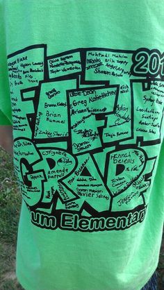 a person wearing a green shirt with writing on it