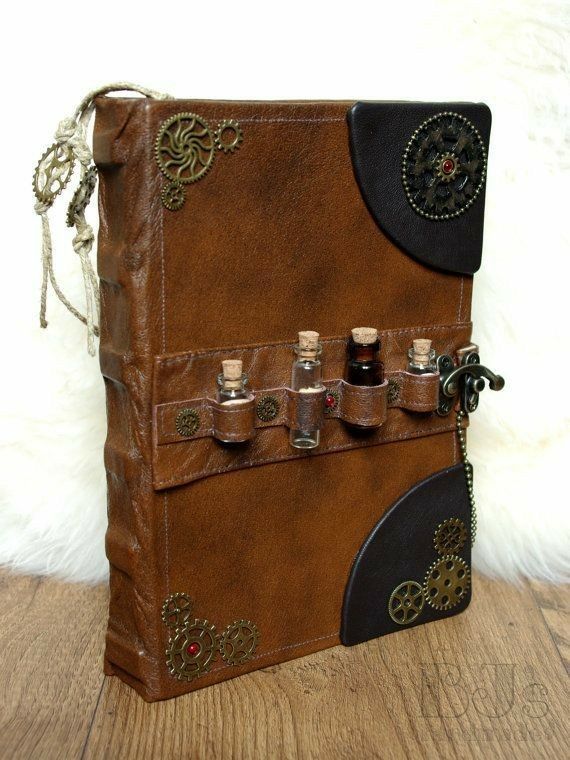 a brown and black leather book with gears on it