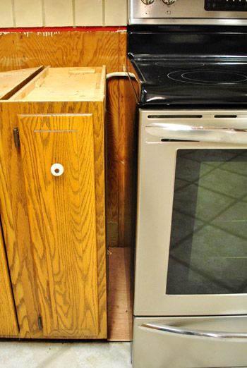 a kitchen with an oven, stove and cabinets