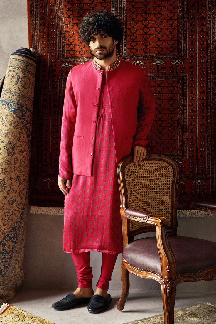 Cherry red straight kurta with all-over printed motifs. Comes with Nehru jacket enhanced with placement resham-dabka work and churidar.
Component: 3
Embroidered, Printed
Neckline: Mandarin Collar
Sleeve Length: Bundi: Sleeveless
Fabric: Tusser Silk, Satin Silk
Color: Red
Welt pocket
Closure: Bundi: Front buttons - Aza Fashions Silk Kurta For Men, Tussar Silk Kurta, Punit Balana, Red Kurta, Kurta Set For Men, Nehru Jackets, Indian Fashion Designers, Satin Silk, Kurta Set