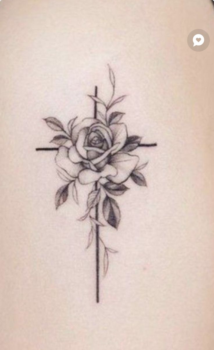 a cross with a rose tattoo on it