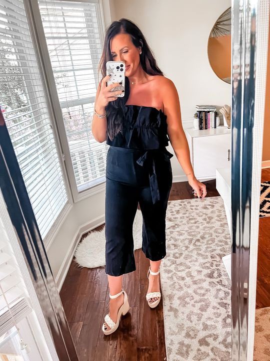 Feeling flirty & fun in this FAB ruffled jumpsuit! 😍 Text MINT to 90243 for 15% off Chic Strapless Jumpsuit With Ruffles For Evening, Chic Strapless Jumpsuit For Going Out, Flirty Ruffled Jumpsuit For Date Night, Sleeveless Ruffled Jumpsuits And Rompers For Night Out, Trendy Ruffled Jumpsuits And Rompers For Day Out, Strapless Ruffled Jumpsuits And Rompers For Date Night, Chic Strapless Jumpsuit For Spring Brunch, Chic Black Jumpsuits And Rompers For Brunch, Chic Black Jumpsuit For Brunch