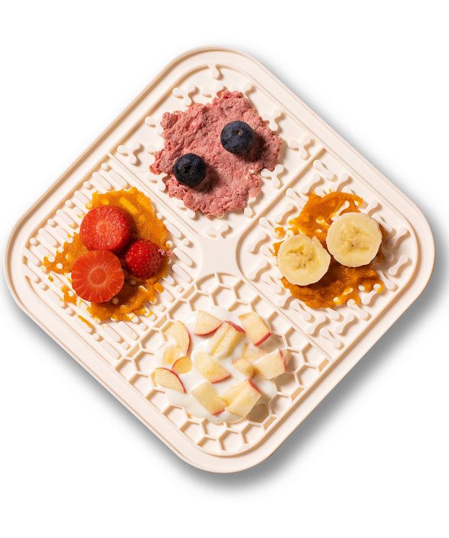 a plastic tray filled with different types of fruit on top of each other next to sliced bananas and blueberries