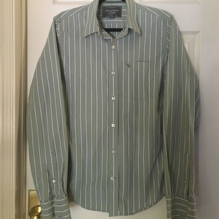 This Is A Beautiful Pale Green Button Down Shirt With Navy And Cream Stripes. Chest Pocket With The Moose Symbol, And Long Sleeves With Two Buttons. Never Worn. Striped Cotton Shirt For Semi-formal Occasions, Green Collared Shirt For Semi-formal Occasions, Spring Cotton Dress Shirt With Buttons, Spring Cotton Dress Shirt, Semi-formal Cotton Shirt With Buttons, Fitted Casual Cotton Blouse, Cotton Long Sleeve Blouse For Semi-formal Occasions, Classic Green Business Casual Shirt, Casual Semi-formal Shirt With Button Cuffs