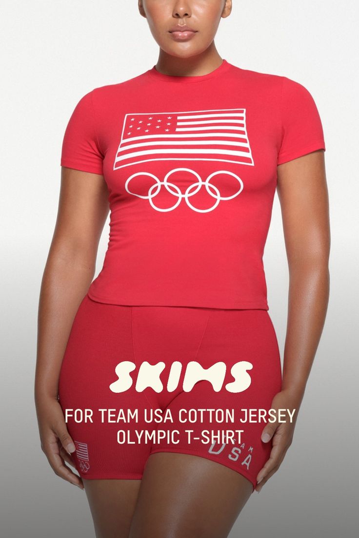 Our viral Cotton Jersey tee with a soft feel and stretchy, body-hugging fit. Detailed with a crew neck, short sleeves, and a length that hits below the natural waist. Features official graphics in support of the Team USA athletes participating in the Olympic Games Paris 2024. Fits true to size. | SKIMS Cotton Jersey Olympic T-Shirt | Red | 2XS | SKIMS For Team Usa Stretch Crew Neck T-shirt With Text Print, Athleisure Stretch T-shirt With Logo Print, Snug Fit Crew Neck T-shirt Athleisure, Snug Fit Crew Neck Athleisure T-shirt, Athleisure Snug Fit Crew Neck T-shirt, Fitted Sports T-shirt With Graphic Print, Logo Print Stretch T-shirt For Summer, Stretch Short Sleeve T-shirt With Sublimation Print, Stretch T-shirt With Logo Print For Summer