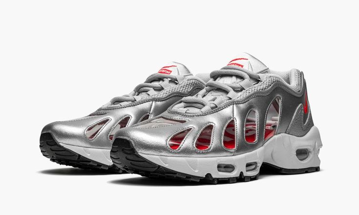 The Supreme x Nike Air Max 96 “Silver” is a Spring 2021 collaboration between the “World Famous” streetwear brand and Nike on the retro running shoe from 1996.  The relatively obscure Air Max 96’s original release was sandwiched between two tentpole Nike Air Max models: the Air Max 95 and Air Max 97, which could explain its slept-on status in the sneaker world.  It has been largely absent from retro releases in recent years, save for Supreme’s unearthing of the shoe for its Spring/Summer 2021 co Modern Metallic Sneakers For Streetwear, Modern Metallic Silver Sneakers For Streetwear, Metallic Silver Sneakers With Reflective Details For Streetwear, Nike Sneakers With Reflective Details For Streetwear, Metallic Sneakers With Reflective Details For Streetwear, Sporty Silver Custom Sneakers For Sports, Silver Sporty Custom Sneakers For Sports, Custom Silver Sporty Sneakers, Sporty Custom Silver Sneakers For Sports