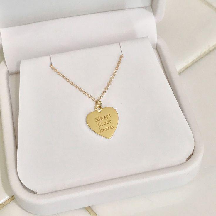 The engravable Medium Size Heart Necklace is composed of 14K solid gold and beautifully complemented by a durable matching 14K solid gold faceted cable chain. This piece is adjustable in length or available to be purchased as a charm alone without the chain. Heart Dimensions: approximately 12mm (w) x 14mm (h) Metal Finish: High Shine Polish This design is available in Rose, White and Yellow 14K Gold This item is proudly made in USA and also available in 18K solid gold options upon request. Kindl 14k Gold Heart Pendant Jewelry For Personalized Gift, Gold Custom Necklace For Anniversary On Valentine's Day, Custom Gold Necklace For Anniversary Gift On Valentine's Day, Custom Yellow Gold Necklace For Mother's Day Anniversary, Custom Yellow Gold Necklace For Anniversary On Mother's Day, Customizable Heart-shaped Yellow Gold Jewelry, Custom Heart Necklace For Mother's Day, Custom Heart Necklace For Valentine's Day Anniversary, Gold Heart Necklace Stamped 14k For Wedding