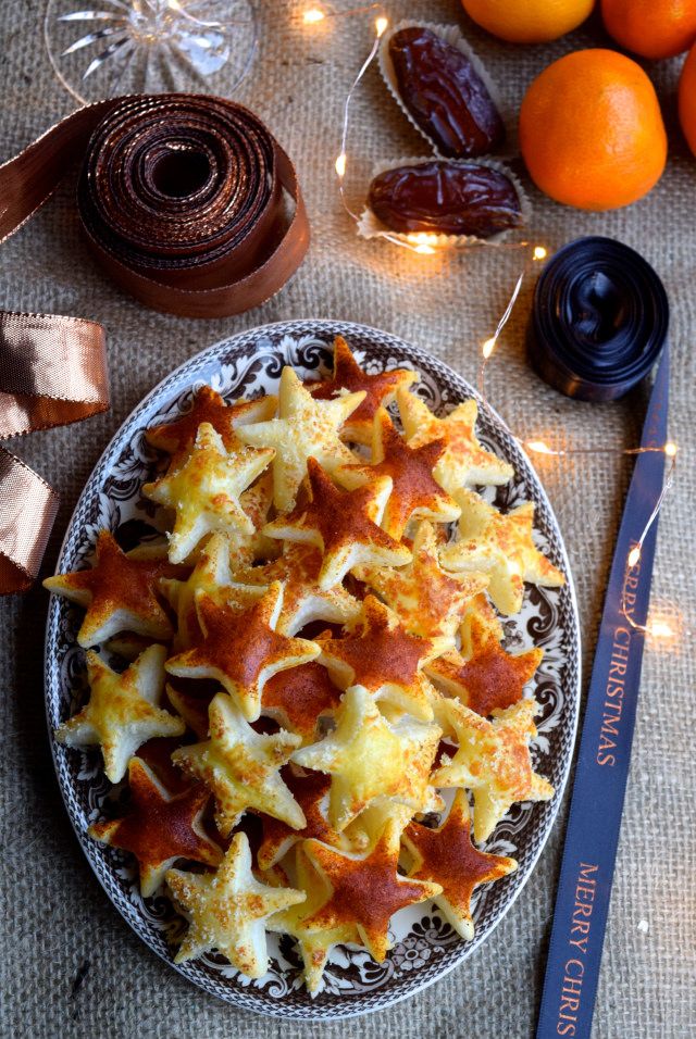 a plate with food on it next to some oranges and other things in the background