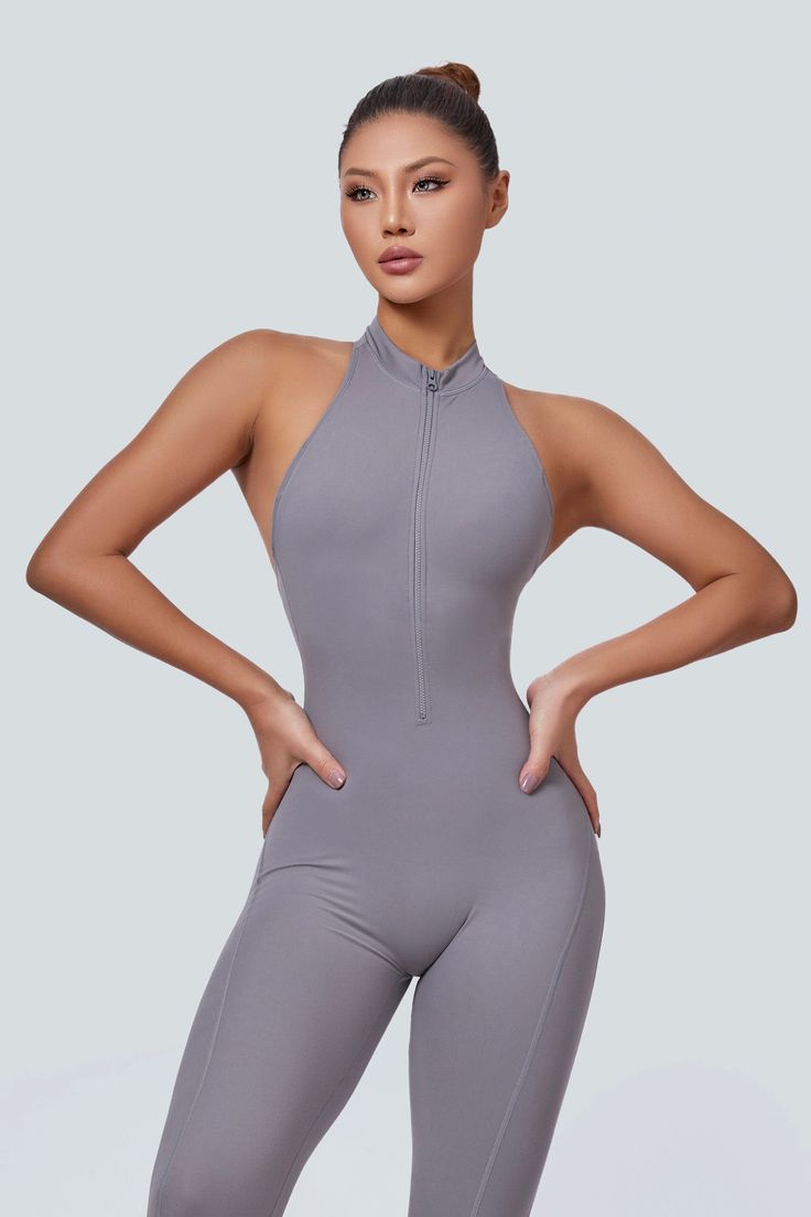 This jumpsuit enhances workouts with its open back for ventilation and stylish racerback detail. It features rear ruching for a flattering look, is designed to sculpt and lift the glutes, and includes removable pads for comfort and versatility. The half-zip closure is convenient for adjustable coverage, and its stretchy design contours to the body, allowing flexible movement. It's suitable for any occasion, blending fashion and function, ideal for active lifestyles. Fabric: Skin-friendly Super s Backless Athleisure Activewear For Workout, High Neck Athleisure Activewear For Gym, Sporty Backless Workout Activewear, Sporty Backless Gym Activewear, Backless Summer Activewear For Gym, Summer Backless Activewear For Gym, Backless Summer Activewear For Sports, Backless Summer Gym Activewear, Summer Backless Gym Activewear