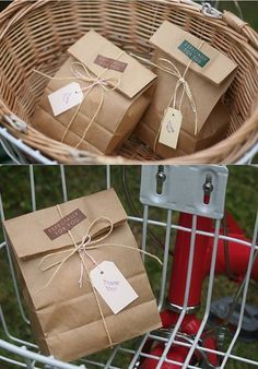 three brown bags tied with twine and sitting in a basket on the back of a bicycle