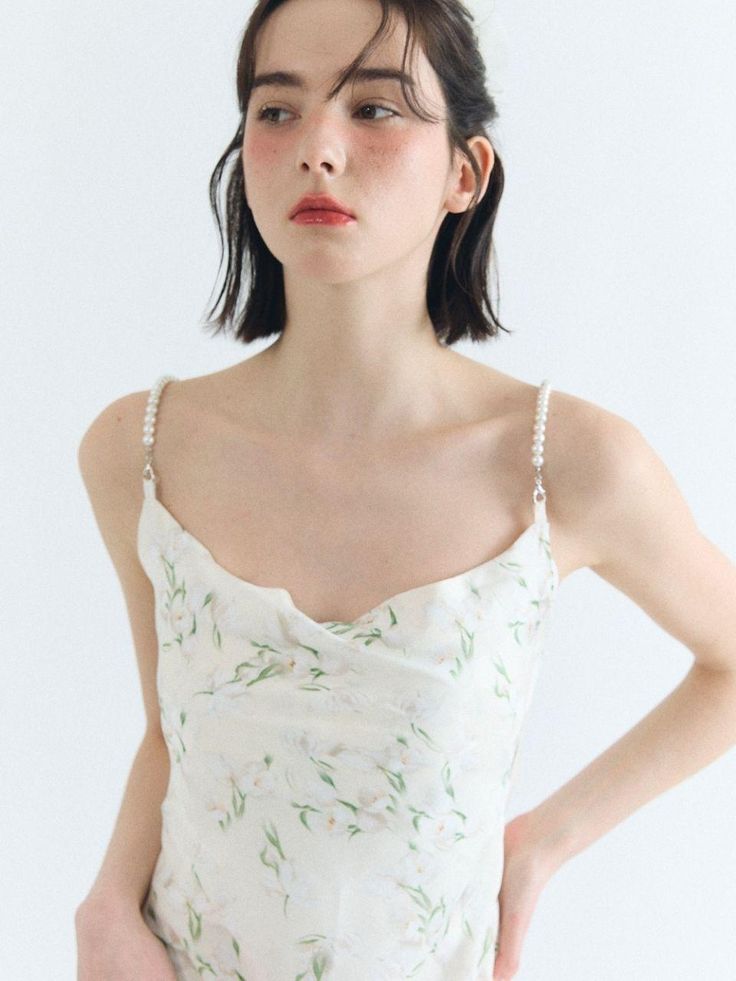 Composition : polyester 100%Color : Light BeigeCountry of Origin : Republic of Korea Elegant Floral Print V-neck Slip Dress, White Spring Party Camisole, White Camisole For Spring Party, Elegant Summer V-neck Camisole, Bias Cut Dress For Garden Party, Elegant Floral V-neck Slip Dress, Elegant V-neck Floral Print Slip Dress, Chic Silk Midi Dress With Adjustable Straps, Chic Silk Dress With Delicate Straps