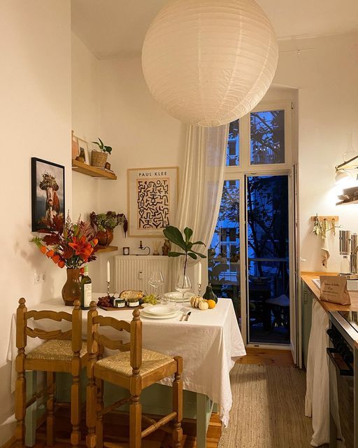 a dining room with a table and chairs