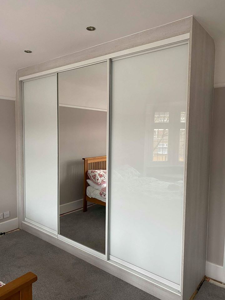 an empty bedroom with sliding glass doors on the wall