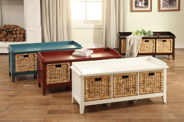 a living room scene with focus on the coffee table and storage baskets in the middle