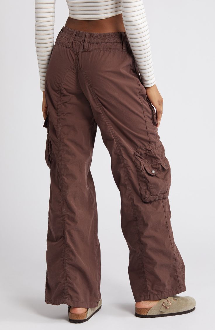 Tap into the retro look you missed the first time around in these all-cotton cargo pants featuring commodious bellows pockets to hold most everything you need. Exclusive retailer 31" inseam; 23 1/2" leg opening; 9 1/2" front rise; 13 1/2" back rise (size Medium) Back elastic waist 100% cotton Machine wash, line dry Made in Turkey Baggy Cargo Pants For Women, Y2k Parachute Pants With Pockets For Fall, Y2k Style Cotton Cargo Pants With Pockets, 90s Style Full Length Cotton Cargo Jeans, Brown Cotton Y2k Pants, Brown Cotton Y2k Style Pants, Y2k Style Brown Cotton Pants, Y2k Cotton Cargo Jeans With Cargo Pockets, Y2k Cotton Cargo Pants With Side Pockets