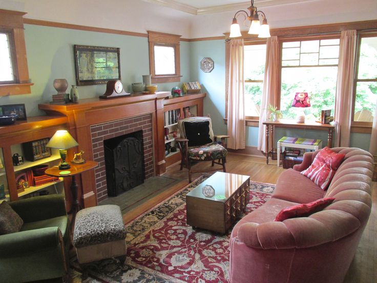 a living room filled with furniture and a fire place