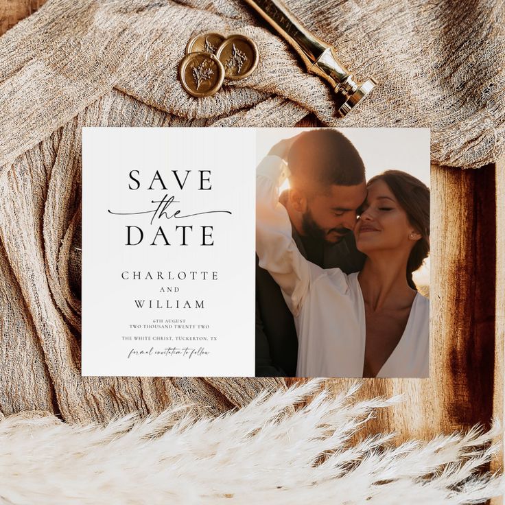 a wedding save the date card on top of a furnishing with an old pair of scissors