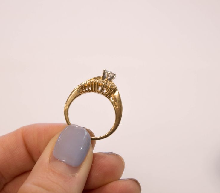 This ring is made out of 14k yellow gold. The main stone is a round diamond that measures approx. 4.5mm, approx. a 3rd ct. The diamond faces white and is clean to the eye. There are 22 small round white full cut diamonds on the outside of the shank. These diamonds vary in size. They measure between 1.2mm- 1.6mm. There are small baguette diamonds that go down the shank. Stamped 14k 6.39 grams Please message for any further questions. Diamond Ring With Single Diamond For Proposal, Yellow Gold Rings With Prong Setting For Proposal, Single Diamond Ring For Proposal, Single Diamond Proposal Ring, Heirloom Diamond Ring For Proposal, Heirloom Style Diamond Ring For Proposal, Proposal Ring In Yellow Gold With Brilliant Cut, Yellow Gold Ring With Prong Setting For Proposal, Fine Jewelry Single Diamond Ring For Proposal