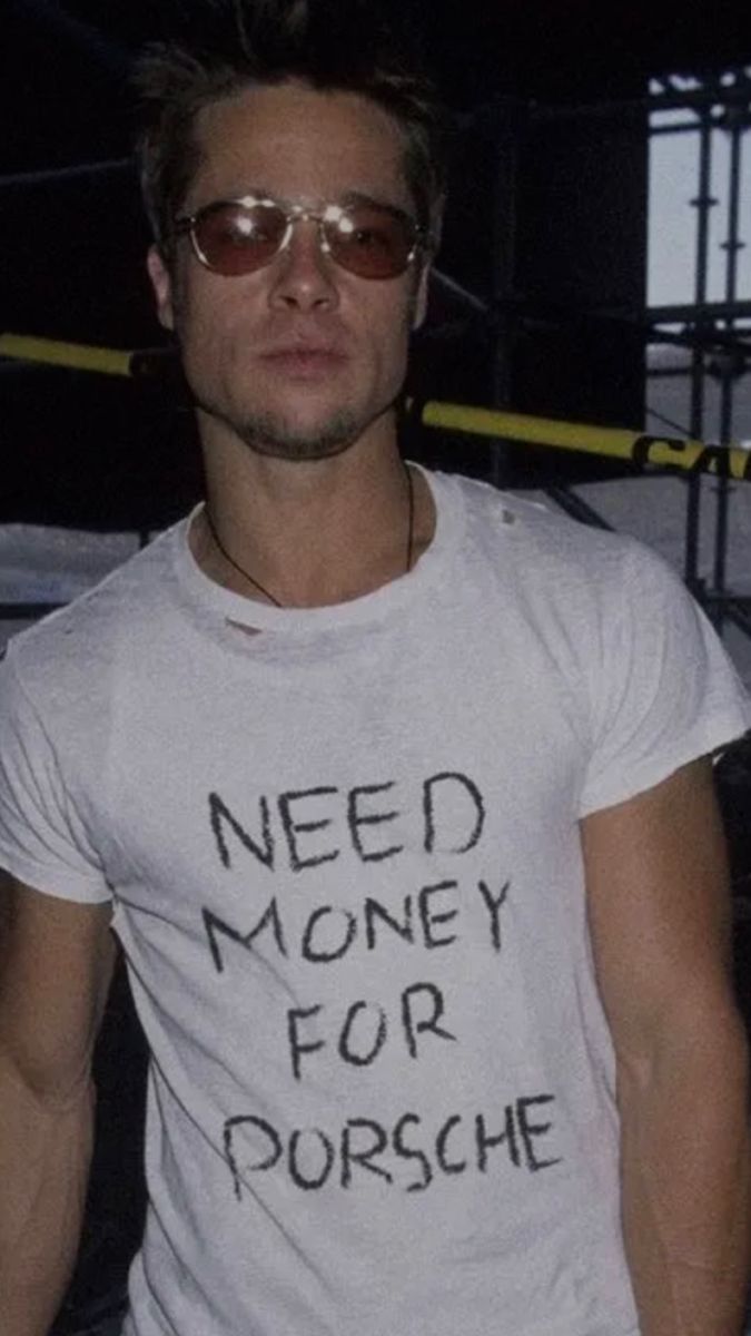 a man wearing sunglasses and a t - shirt that says need money for pursche