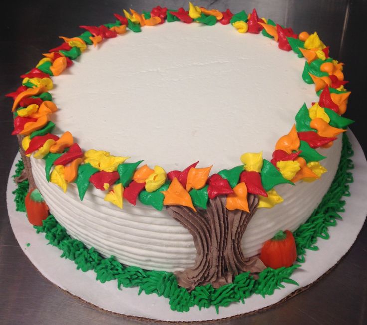 a cake decorated with leaves and a tree