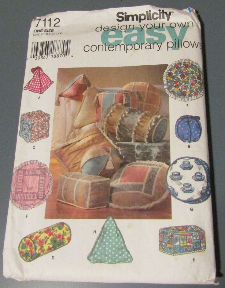 an old book with pictures of furniture and pillows on the cover, sitting on a table