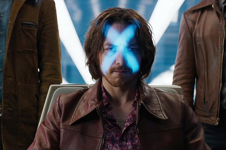 the x - men are looking at something with blue lights on their face and hands