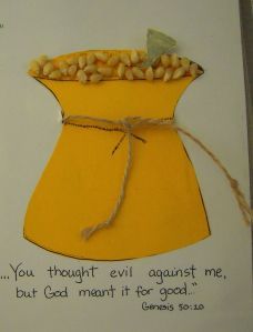 a card with an image of a yellow vase filled with corn on the cob that says, you thought evil against me but god meant it for good