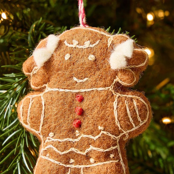 a brown ornament hanging from a christmas tree