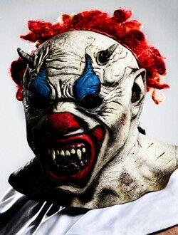 a creepy clown with red hair and blue eyes