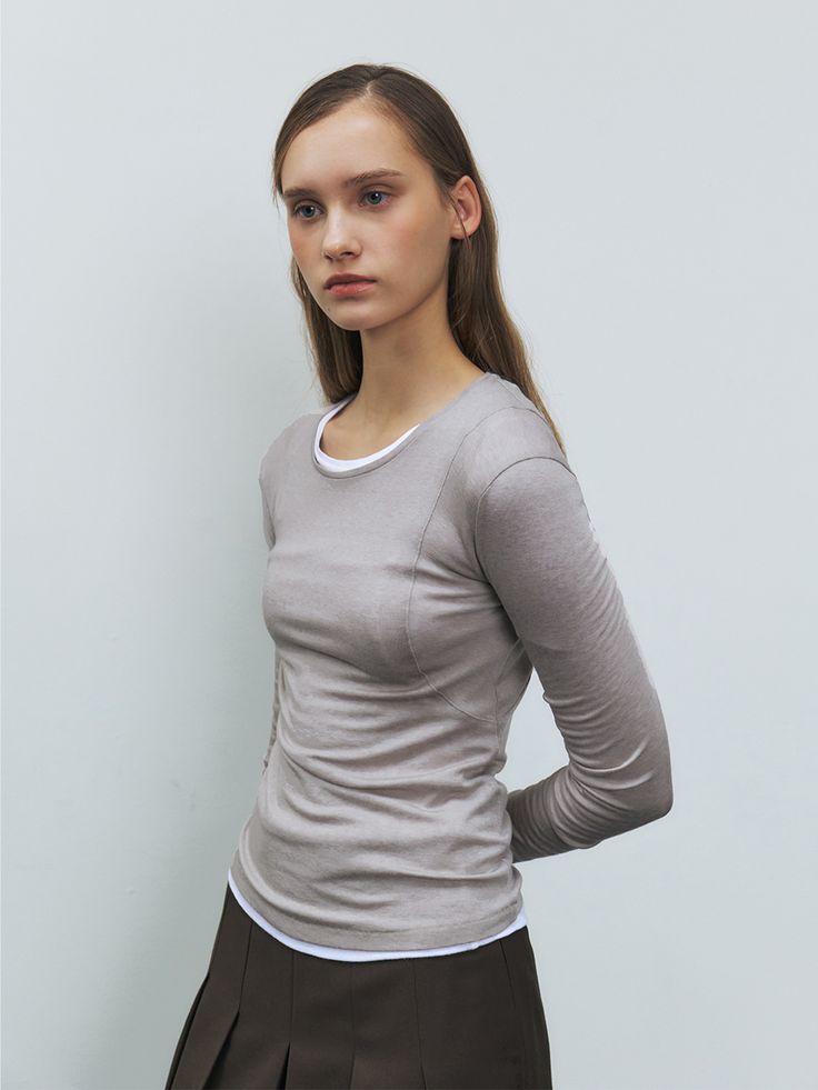 Editor's noteEssentialjersey top that made of wool blended fabric that has soft texture andcomfortable fit. The fabric is slightly see-through which makes it moreversatile to layer with various tops in transitional seasons. The uniquearmhole seam line design and thumbhole detail of the cuffs are also highlighted.Comes in 2 sizes. - Rounded neckline- Thumbholedetail- Seam linedesign- Slightly see-through Measurements(in.)SIZE(S/M)- Shoulder: 14.17in / 14.56 in- Chest: 13.77in / 14.56 in Fitted Long Sleeve Top For Layering, Casual Fitted Long Sleeve Top For Layering, Stretch T-shirt For Winter Layering, Versatile Fitted Fine Knit Top, Fitted Knit Top For Layering, Versatile Fine Knit Fitted Top, Basic Tops With Minimal Stretch For Layering, Versatile Fitted Knit Top For Layering, Solid Fine Knit Tops For Layering