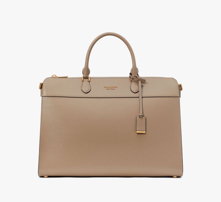 Looking for an elegant handbag that also fits your 16 laptop? We got you. This roomy Morgan style is done in scratch-resistant Saffiano leather with polished gold-tone hardware for a luxe look. | Kate Spade Morgan Laptop Bag, Timeless Taupe Gold Bags With Detachable Handle For Work, Gold Workwear Bag With Detachable Handle, Gold Top Handle Satchel For Work, Gold Satchel With Detachable Strap For Work, Gold Satchel With Detachable Handle For Work, Gold Bags With Top Carry Handle For Work, Gold Rectangular Bags For Work, Designer Gold Satchel For Business, Rectangular Gold Bags For Work