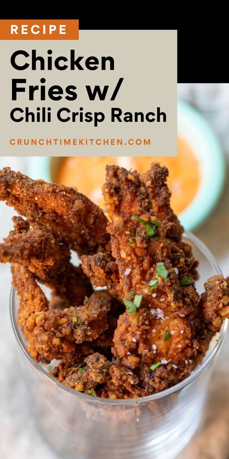 chicken fries w / chili crisp ranch recipe in a small glass bowl with text overlay