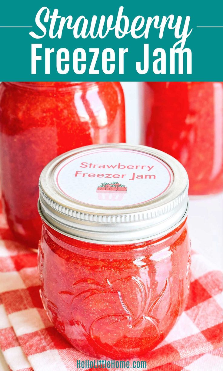 strawberry freezer jam in a mason jar on a checkered tablecloth with text overlay