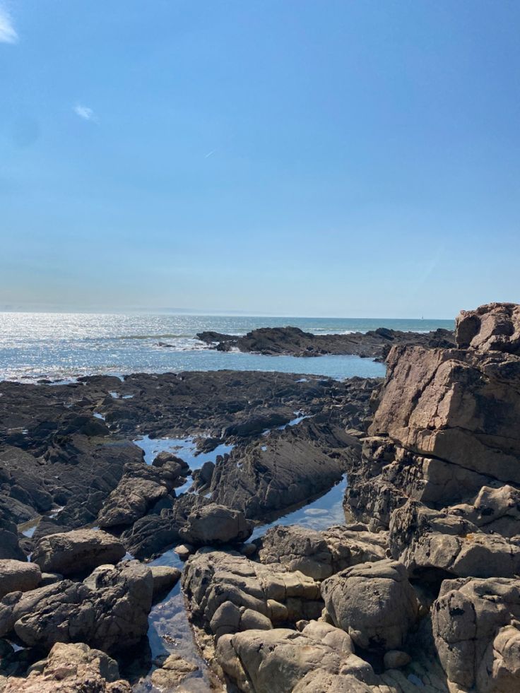 the rocks are covered with water and sand