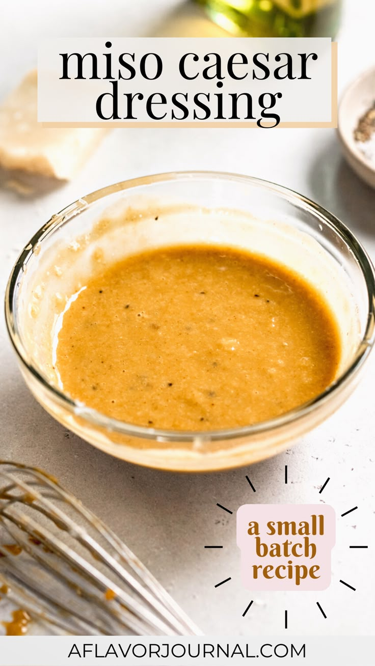 a glass bowl filled with sauce on top of a table