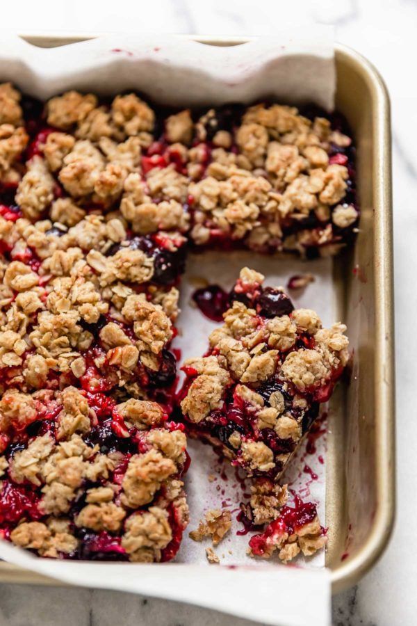 berry crumble bars in a baking pan ready to be eaten