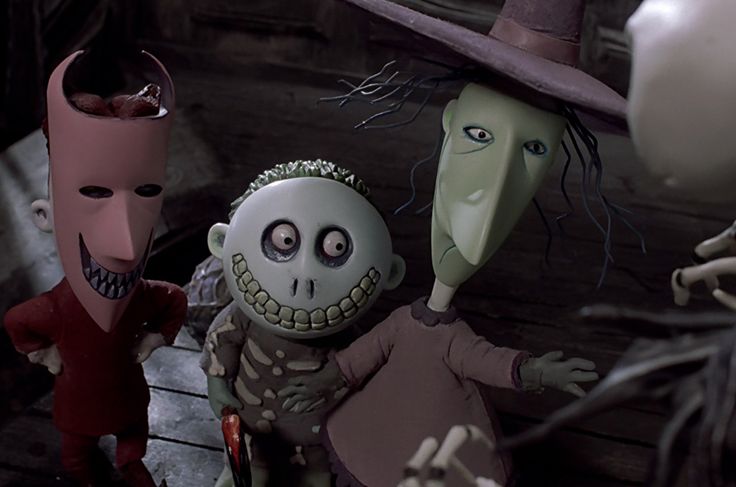 three animated characters dressed in halloween costumes, one with a creepy face and the other wearing a top hat