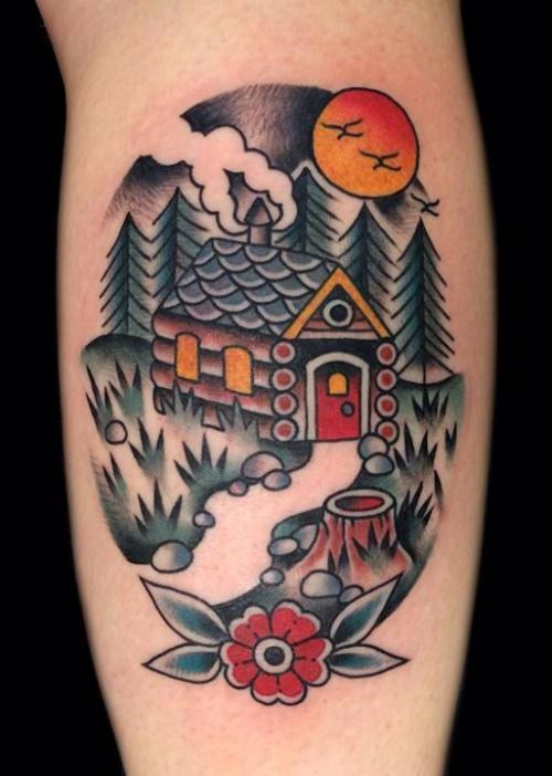 a tattoo with a house and flowers on the thigh, in front of a full moon