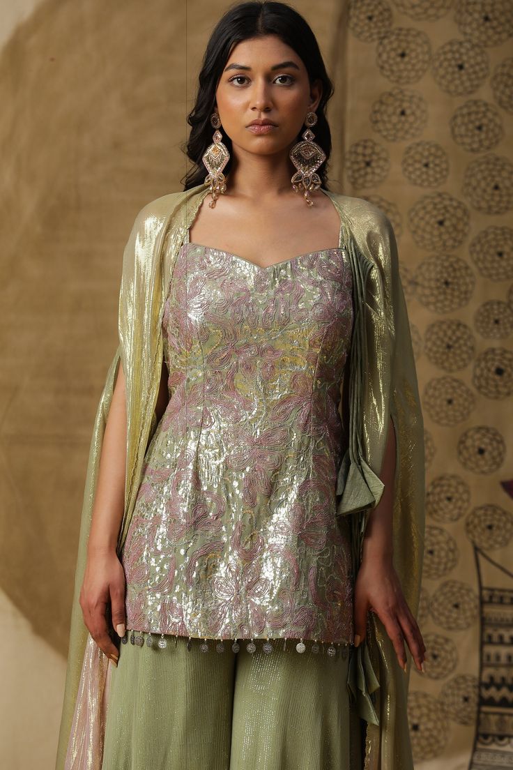 Indian Short kurta in georgette fabric. Comes with palazzos and detachable dupatta. Perfect for wedding occasions or any semi formal functions. Can be made in any colour and size. Fusion wear perfect for all body types Pista Green Palazzo Set For Reception, Pista Green Palazzo Set For Reception With Traditional Drape, Green Sharara With Straight Kurta For Reception, Fitted Green Georgette Palazzo Set, Elegant Pista Green Palazzo Set With Traditional Drape, Elegant Green Palazzo Set With Traditional Drape, Green Georgette Palazzo Set With Traditional Drape, Floor-length Pista Green Georgette Palazzo Set, Fitted Pista Green Georgette Palazzo Set