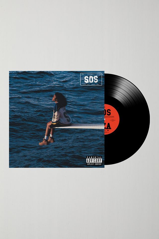 a black and orange vinyl record with the words sos on it