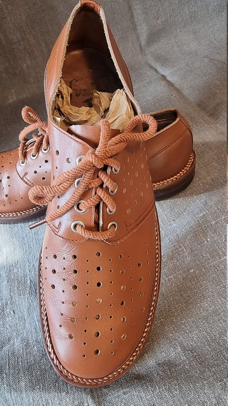 "In leather with welt sewn rubbersole Size 41 inside 26.5 cm with 10.5 cm Size 42 inside 27.5 cm width 10.5 cm Size 43 inside 28 cm width 10.5 cm Our shoes have never been used and are in excellent condition. Most of our pairs will be delivered in the original carton. As they have been in storage for 40+ years, they can have a bit of an \"attic\" smell. If you use your shoes this will soon be gone If you buy many pairs we will refund any shipping overages Always use a shoehorn when you put your Brown Leather Lace-up Shoes With Perforated Toe Box, Brown Closed Toe Dress Shoes With Rubber Sole, Oxfords With Perforated Toe Box And Round Toe, Brown Round Toe Oxfords With Removable Insole, Oxfords With Removable Insole And Round Toe, Leather Walking Shoes With Round Toe For Business, Brown Closed Toe Lace-up Shoes For Derby, Formal Walking Shoes With Ortholite Insole And Round Toe, Classic Leather Shoes With Perforated Toe Box