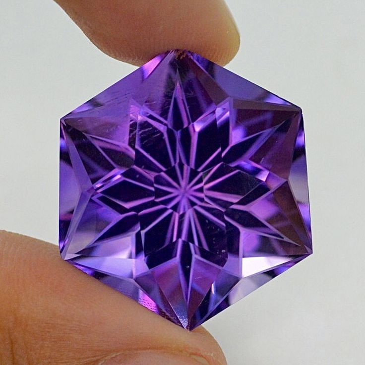 WOWZA! If you're looking for a gemstone that is bigger than a doorknob, have we got the Amethyst for you! Not only is it big and impressive, but the color is entirely natural. No treatment on this stone! Weight: 56.15ct Dimensions: 28.6 x 25.3 x 18.2mm Source: Mexico Disclosure: Please note the inclusion in one corner that is readily visible in the photos. This inclusion is barely noticeable but we want to bring it to your attention. Click here to learn more about Amethyst Did you know that The Shiny Rocks, Gemstone Art, Faceted Gems, Amethyst Gem, Jewelry Stone, Mineral Stone, Minerals And Gemstones, Rocks And Gems, Precious Gems