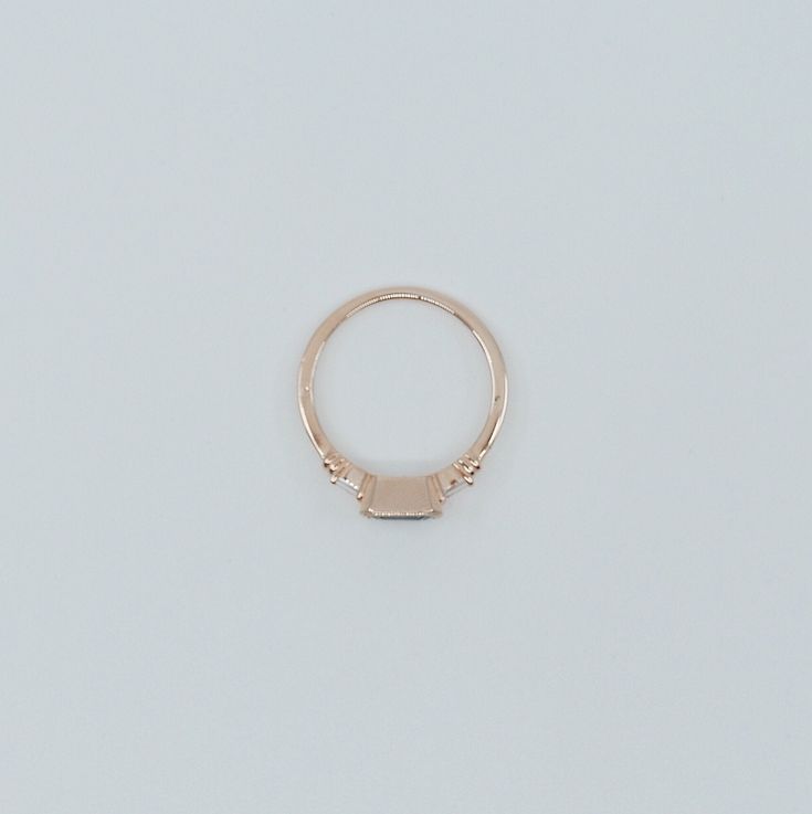 The Maggey ring is like an old soul, a classic beauty with hints of the modern woman. This up-to-date vintage inspired ring can be worn as an alternative engagement ring, or as an everyday ring. Details: 14k gold (available in rose, white or yellow gold)Emerald cut Blue Sapphire is 5.5mm x 4mm Tapered diamond baguettes about 2.5x1.4mm Also available in Green and Pink Tourmaline (please see other listings) Free Shipping on Domestic Orders Materials: Sapphire, diamond, 14k gold, blue sapphire Need White Gold Sapphire Ring, An Old Soul, Vintage Inspired Rings, Alternative Engagement Ring, Gold Chain Choker, Dainty Choker, Diamond Stacking Rings, Everyday Ring, Blue Sapphire Ring